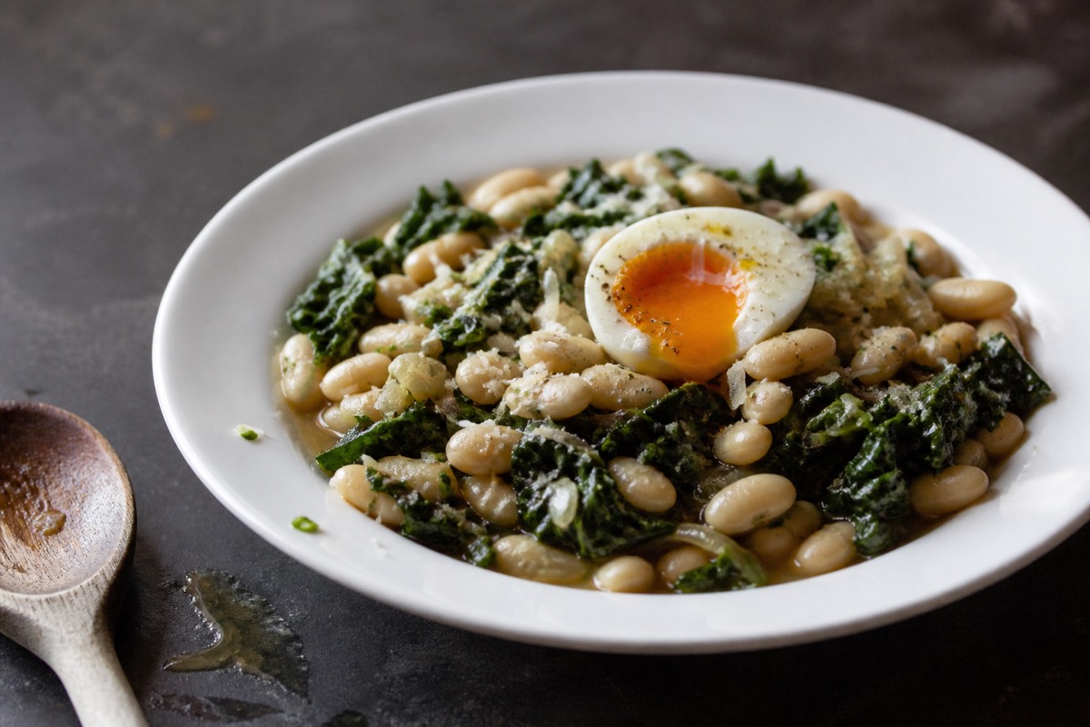 Parmesan-braised white beans with cavolo & egg
